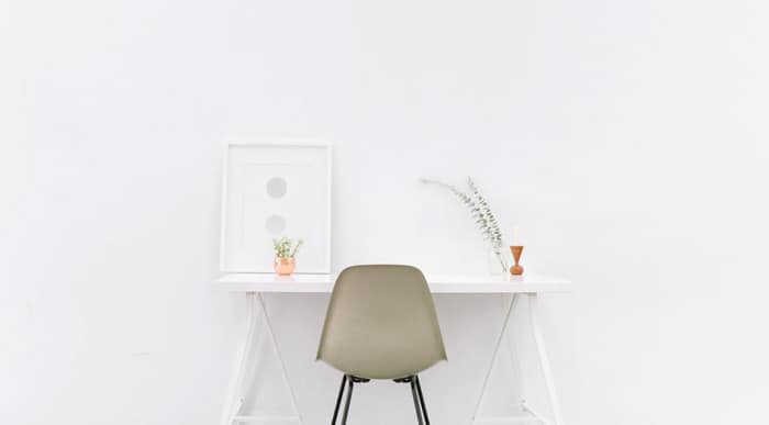 white wooden table near brown chair